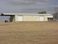 30' x 70' x 14'custom kit building with 30' x 24' x 14' gable extension and 10' x 10' x 8' single slope lean-too covered porch area.