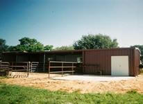 Custom built all welded horse stalls and tac room with pipe pens.