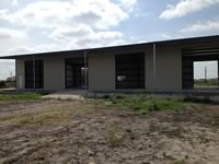 50' x 100' x 16' weld up with a 25' x 100' lean too for an Implement Shed/Workshop