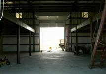 Custom all welded metal shop with two mezzanines